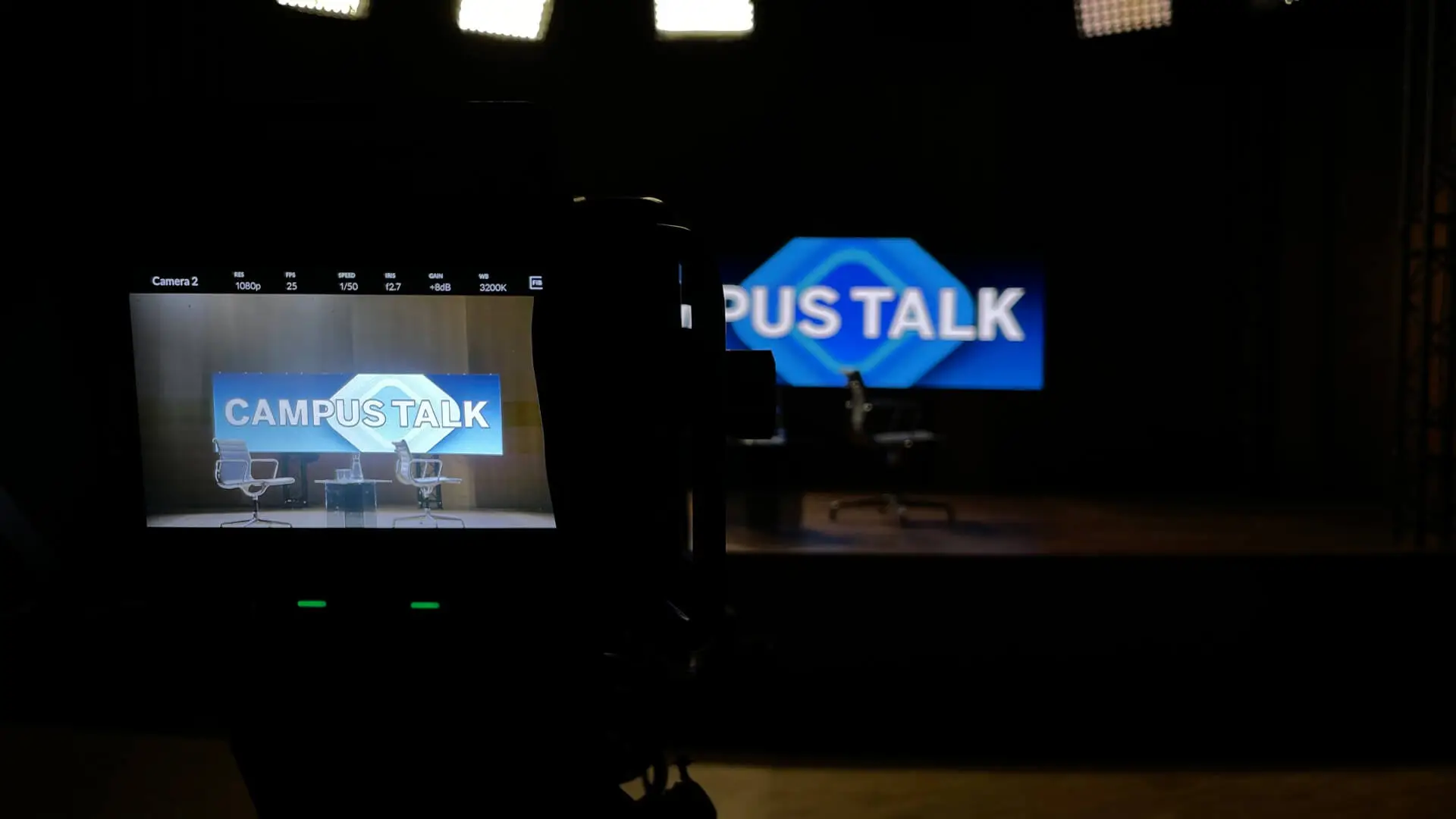 Camera monitor showing the Campus Talk LED backdrop on set for the Netflix series Amsterdam Empire, with screen playback and LED brightness prepared for camera.